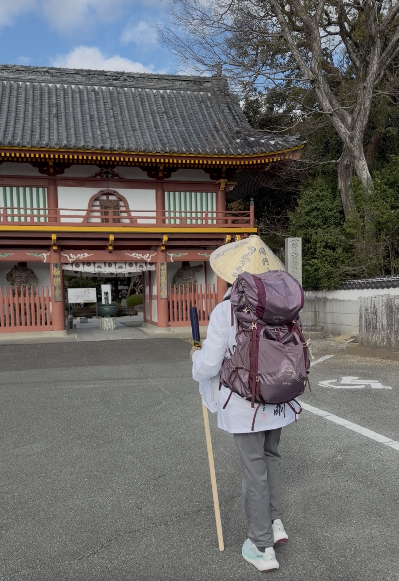 Henro walking toward a temple on the 88 Temples Pilgrimage Shikoku